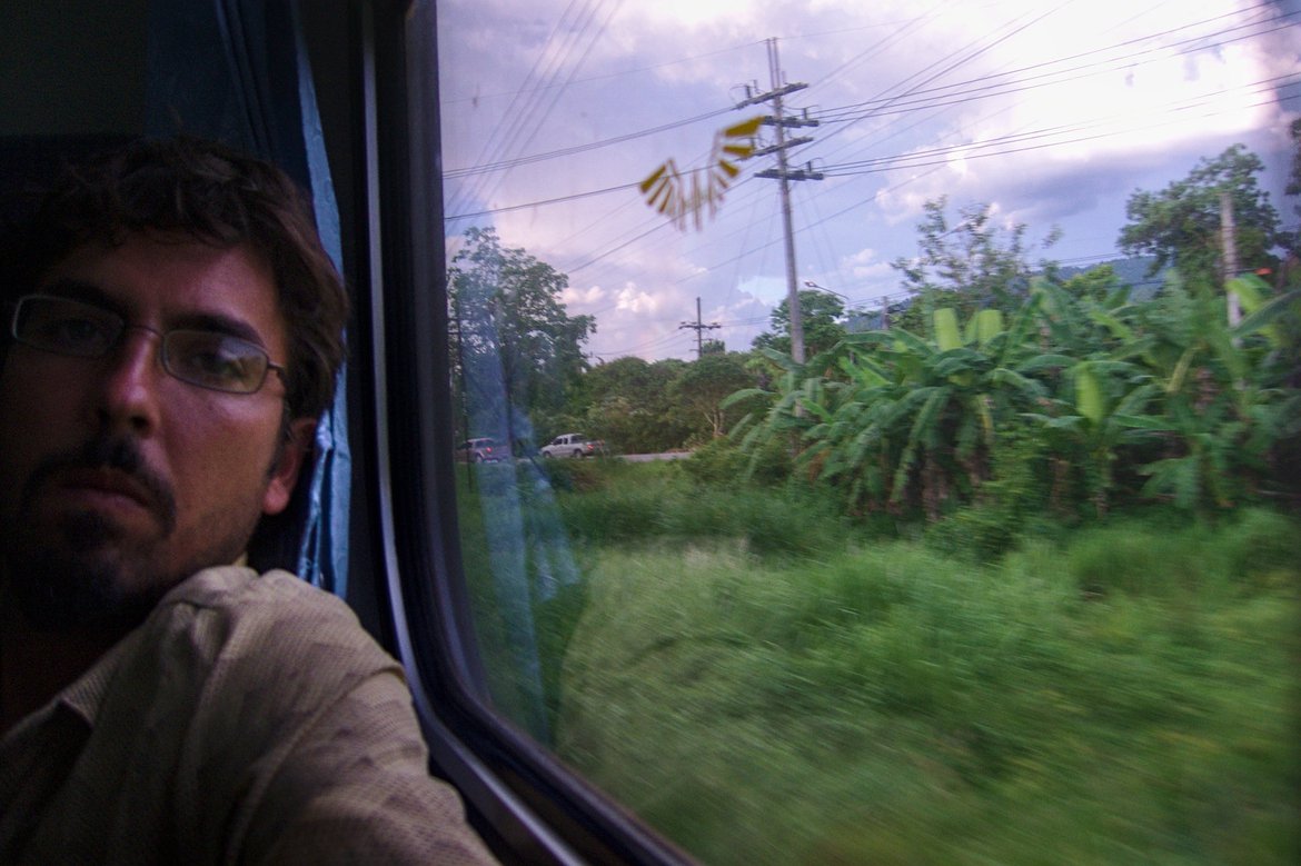 me looking out the window of a train, Thailand photographed by luxagraf