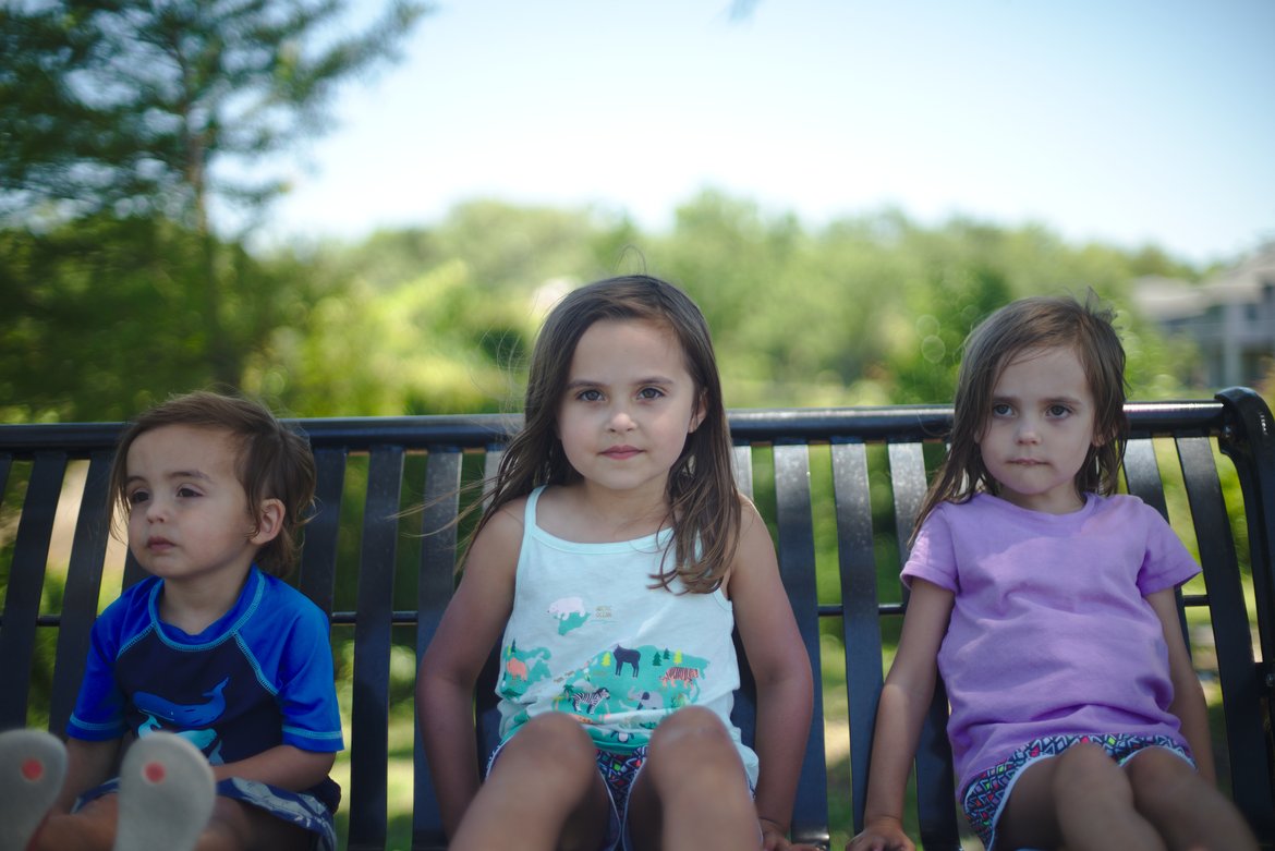 kids on a bench, ocean springs, ms photographed by luxagraf