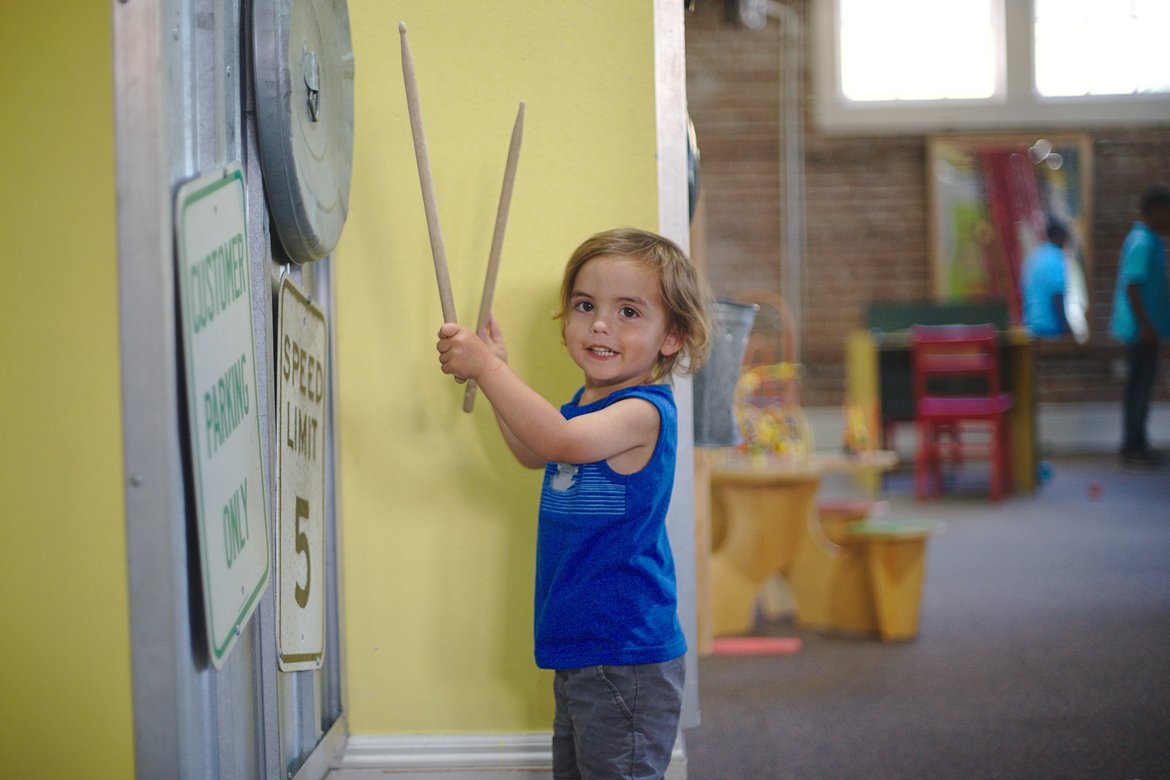 playing drums at the children's museum photographed by luxagraf