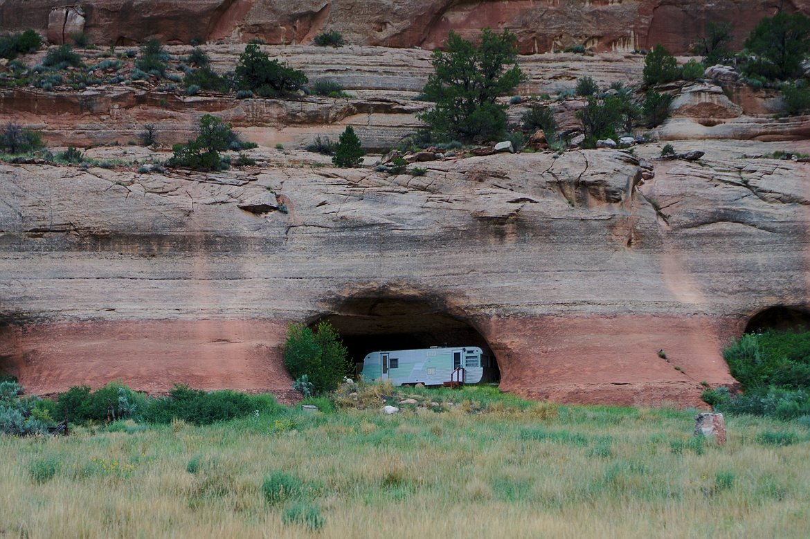 vintage trailer in rock cave photographed by luxagraf