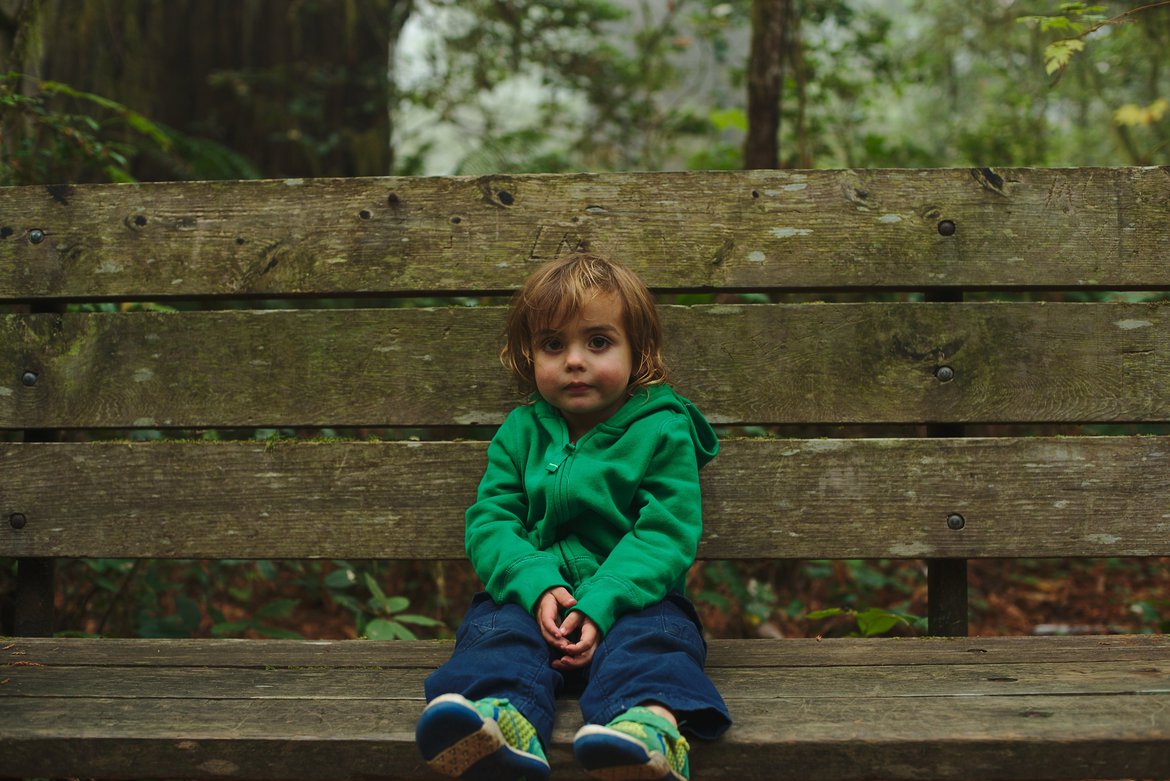 kid on a bench, redwods photographed by luxagraf