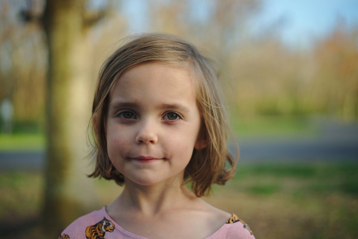 girl smiling photographed by luxagraf