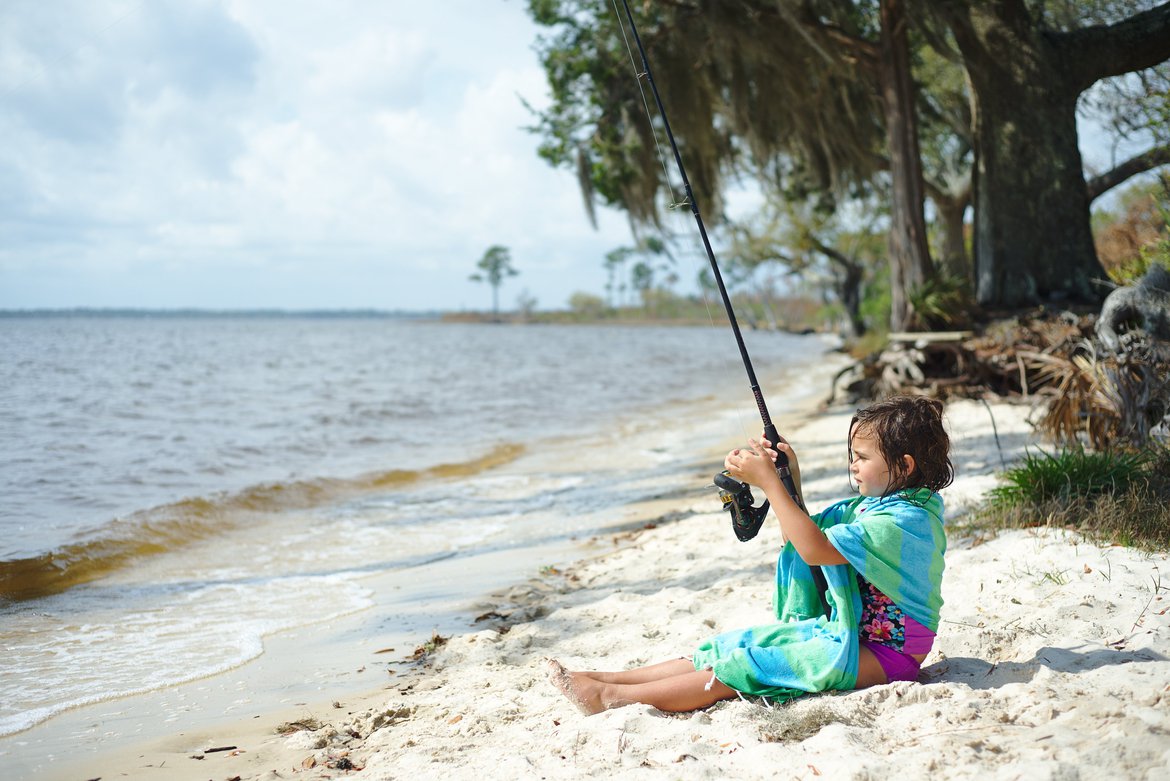 girl fishing, east bay, pensacola, FL photographed by luxagraf