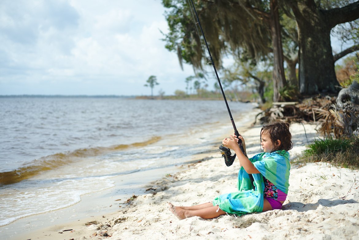 girl fishing, east bay, pensacola, FL photographed by Scott Gilbertson