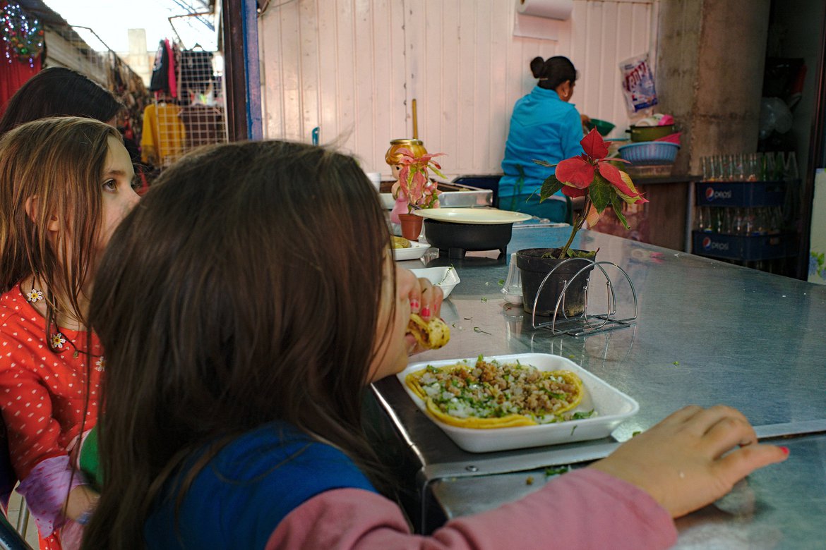 eating tacos in mercado san juan de dio, san miguel de allende, mx photographed by luxagraf