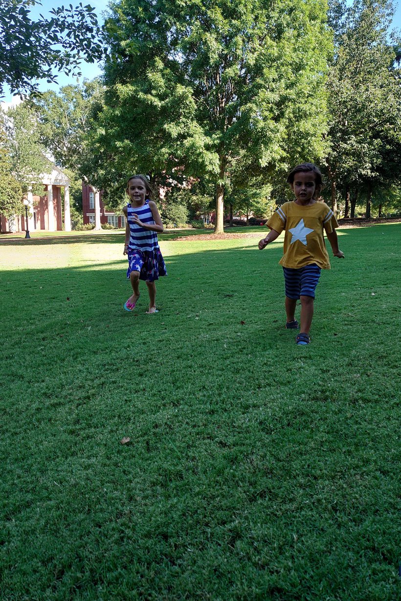 running on UGA lawn, downtown Athens, GA photographed by luxagraf