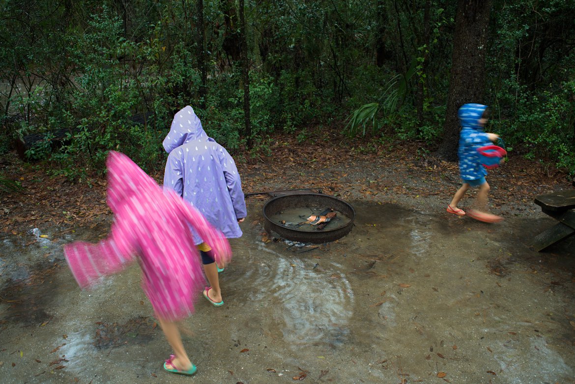 kids splashing in the rain, edisto state park, south carolina photographed by luxagraf