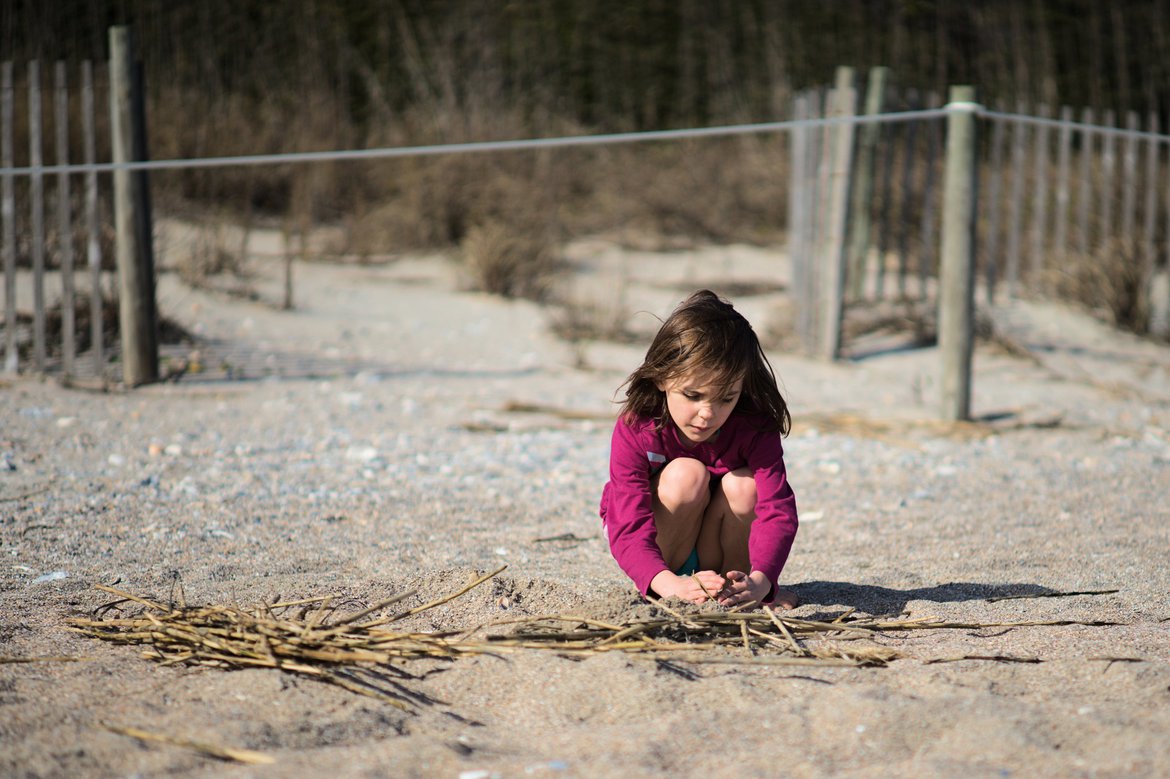 girl playing in the sand, edisto state beach, sc photographed by luxagraf