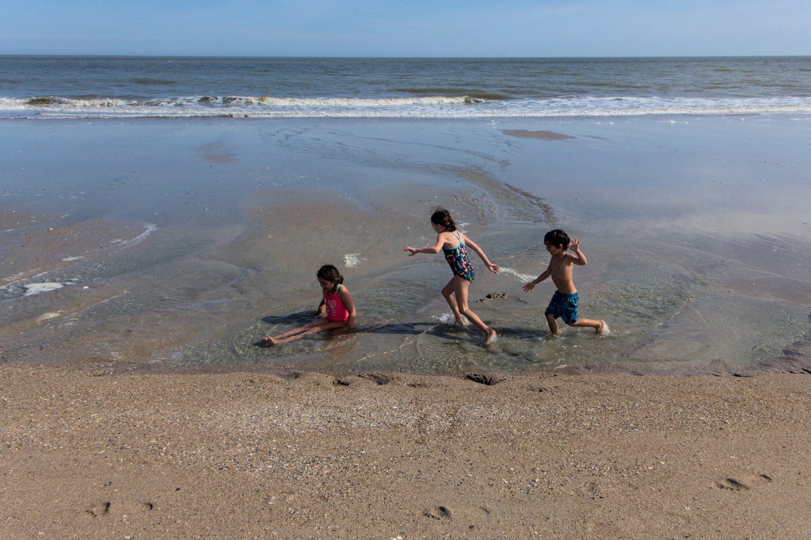 kids running on the shore, edisto state beach photographed by luxagraf