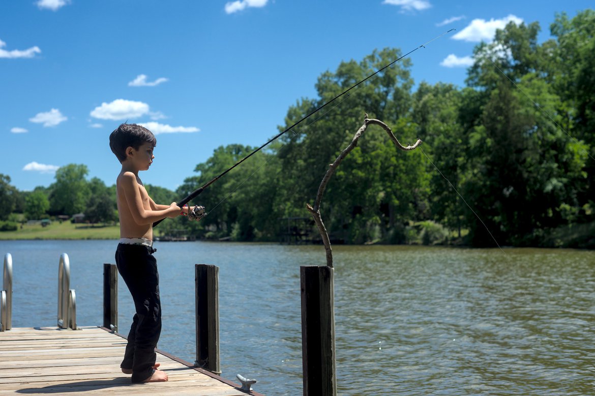 boy fishing photographed by luxagraf
