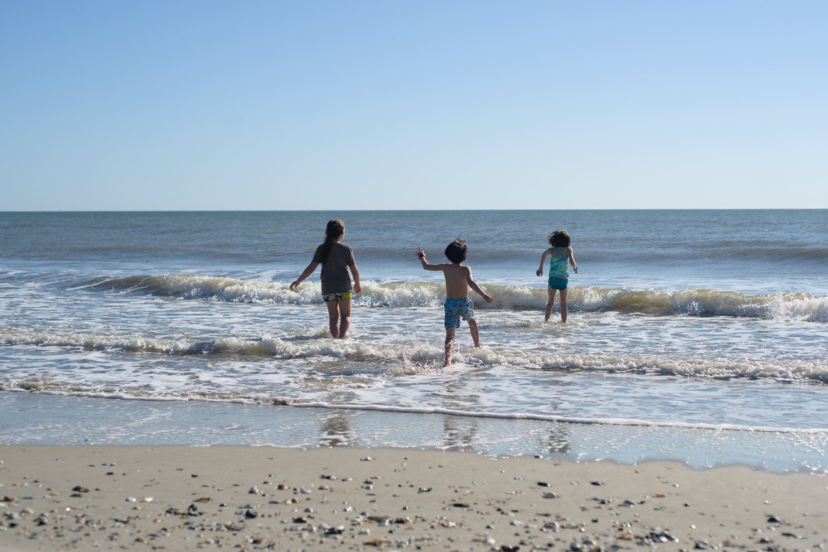 kids playing in the surf, edisto beach, sc photographed by luxagraf