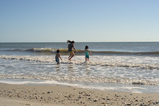 kids playing in the surf, edisto beach, sc photographed by luxagraf