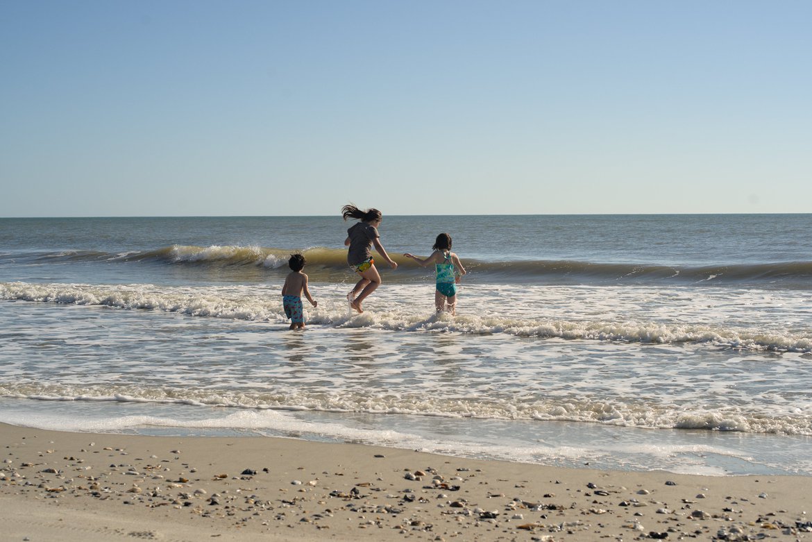 kids playing in the surf, edisto beach, sc photographed by Scott Gilbertson