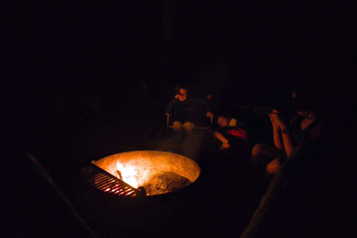 sitting around the fire at night, hunting island, sc photographed by luxagraf