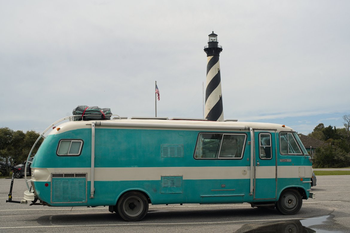 the bus in front of cape hatteras lighthouse photographed by luxagraf