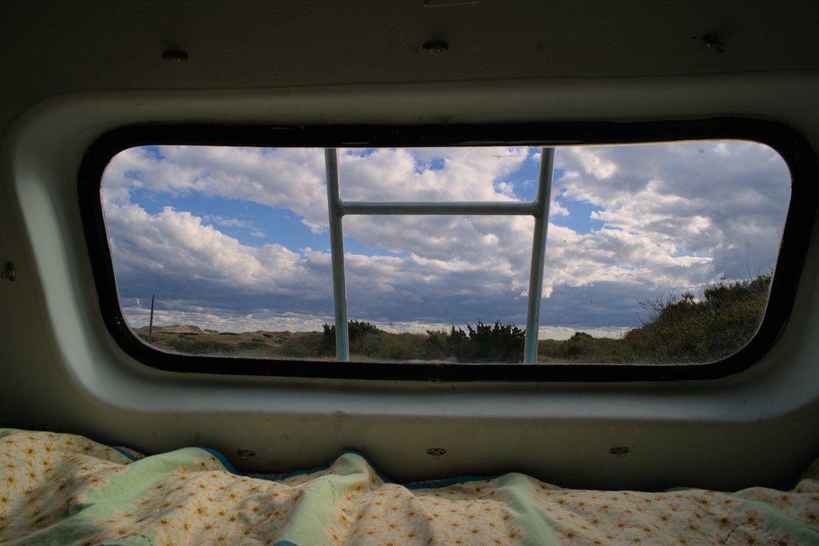 view out the back window of the bus, hatteras island, nc photographed by luxagraf