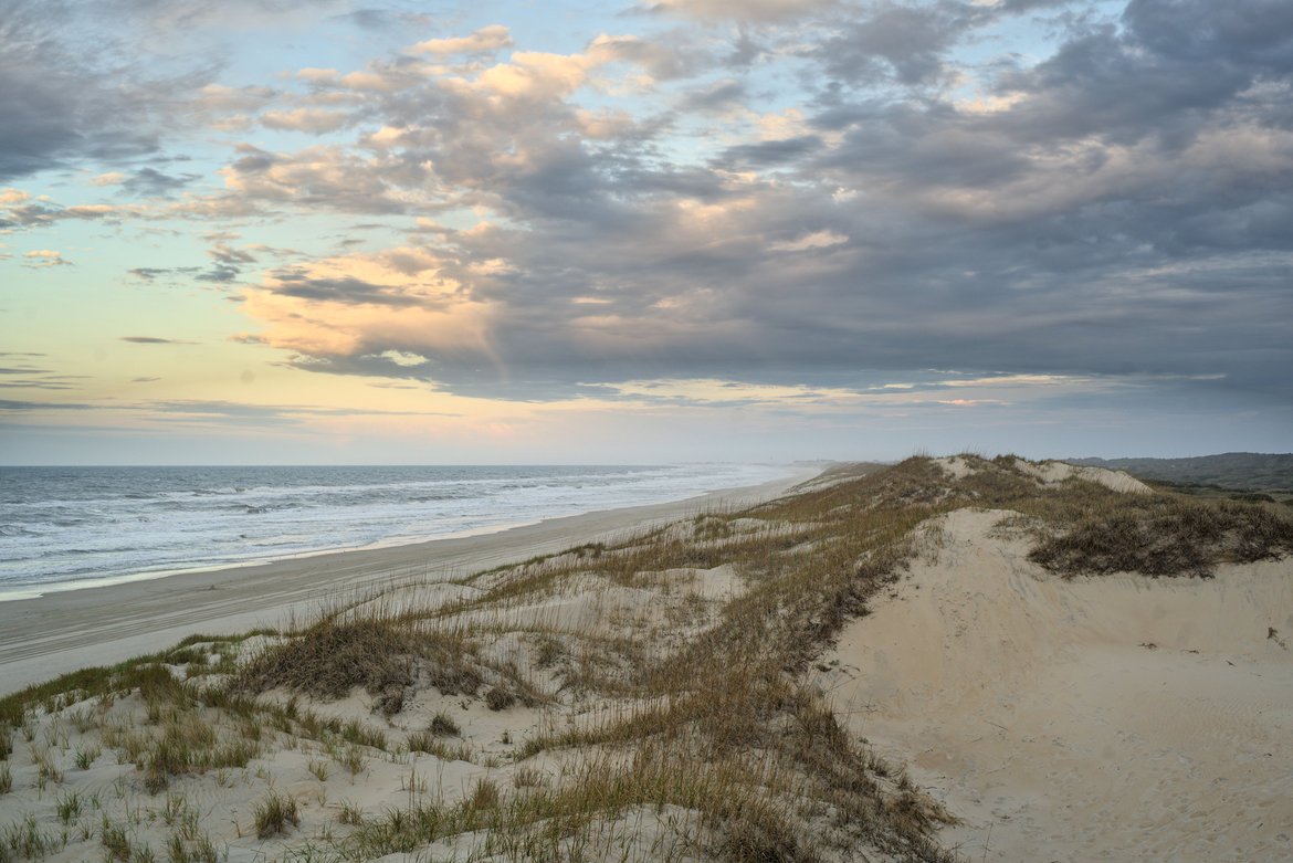 Sunrise over the dunes, hatteras island, nc photographed by Scott Gilbertson