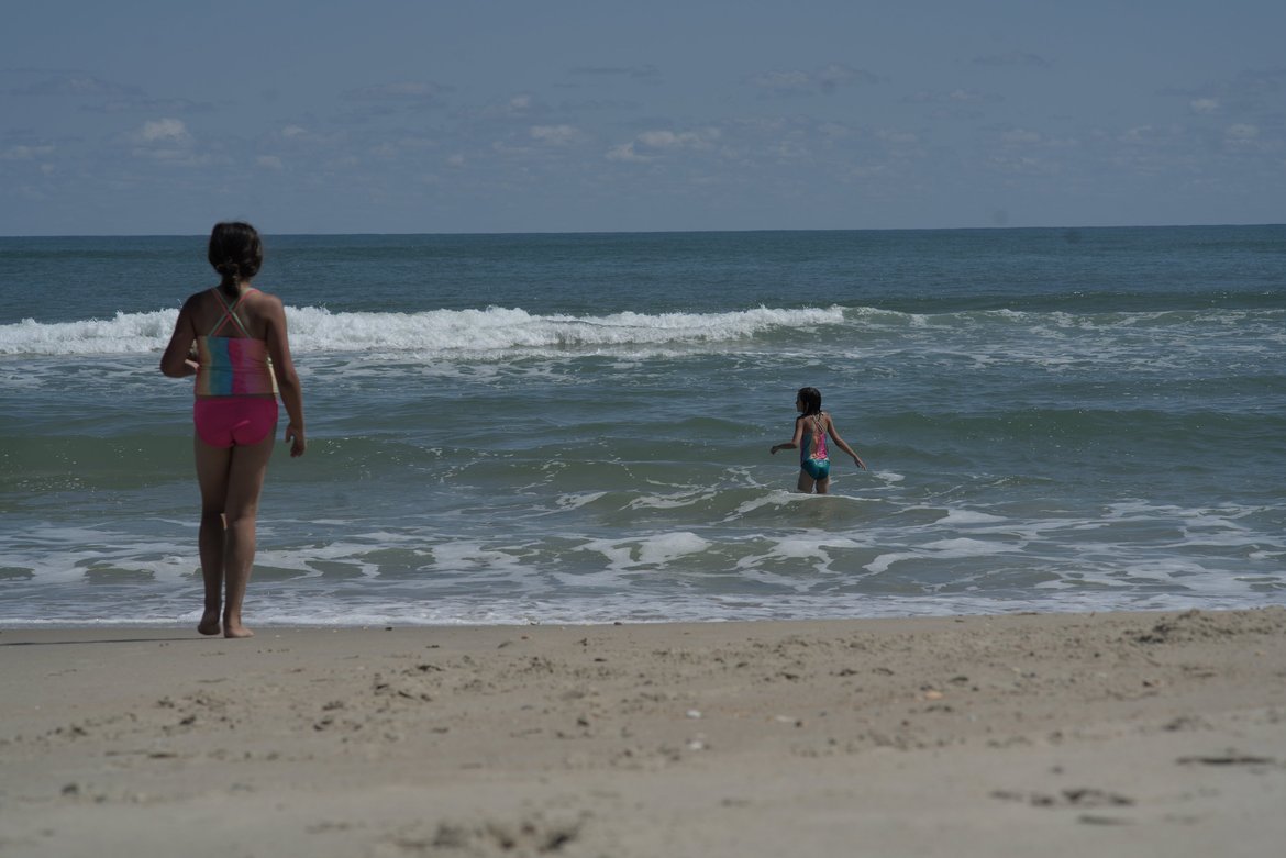 kids playing in the surf, ocracoke, NC photographed by luxagraf