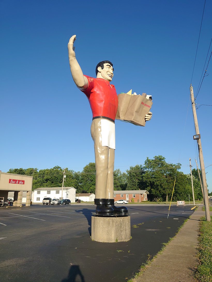 statue at the big john grocery store photographed by luxagraf