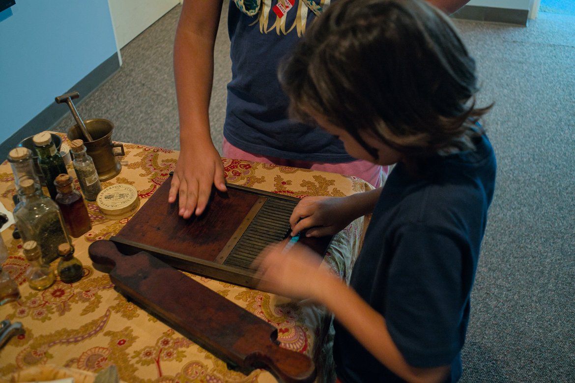 making pills, reenactment camp, Madeline island photographed by luxagraf