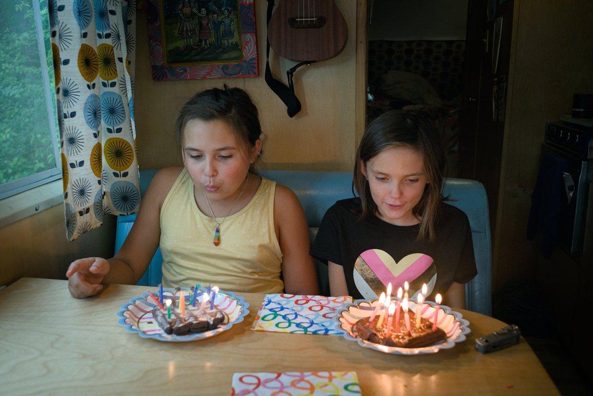 kids blowing out candles on waffle birthday cakes photographed by luxagraf