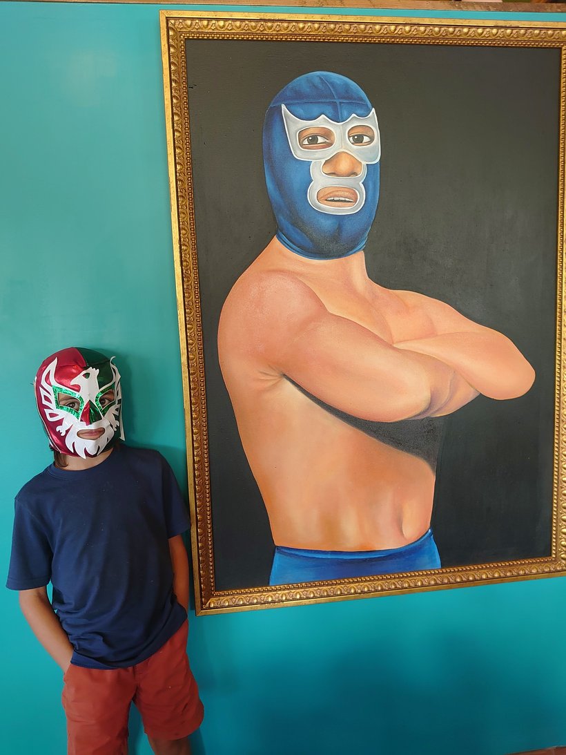 boy with a lucha libre mask photographed by luxagraf