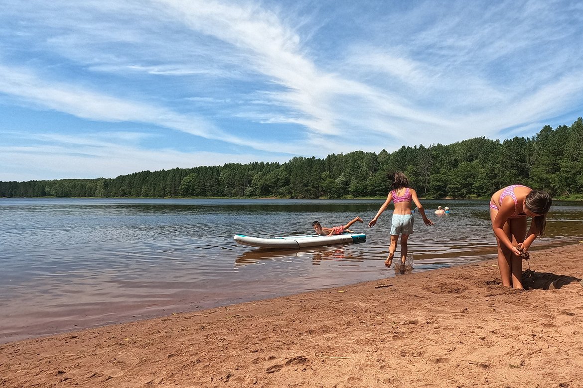 kids playing on paddleboard, long lake, wisconsin photographed by luxagraf
