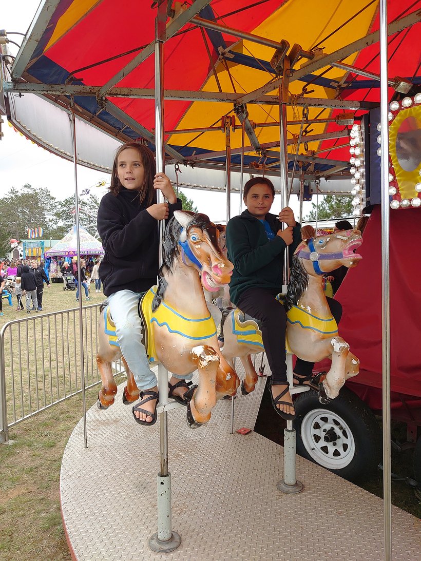 riding the merry-go-round at the county fair photographed by luxagraf