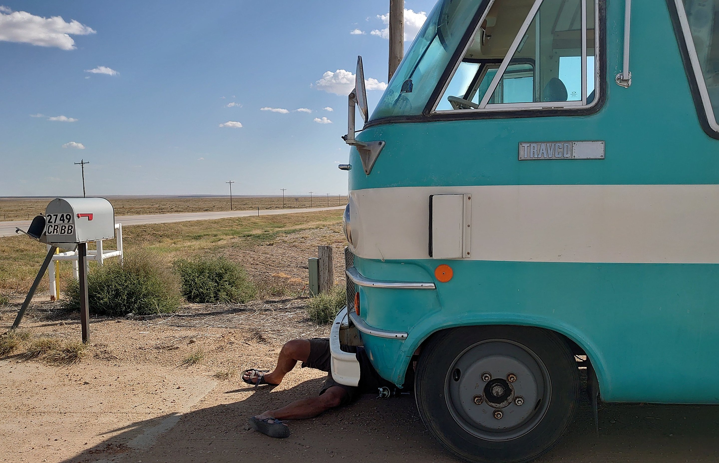me under the bus, replacing the fuel pump at the side of the road photographed by luxagraf