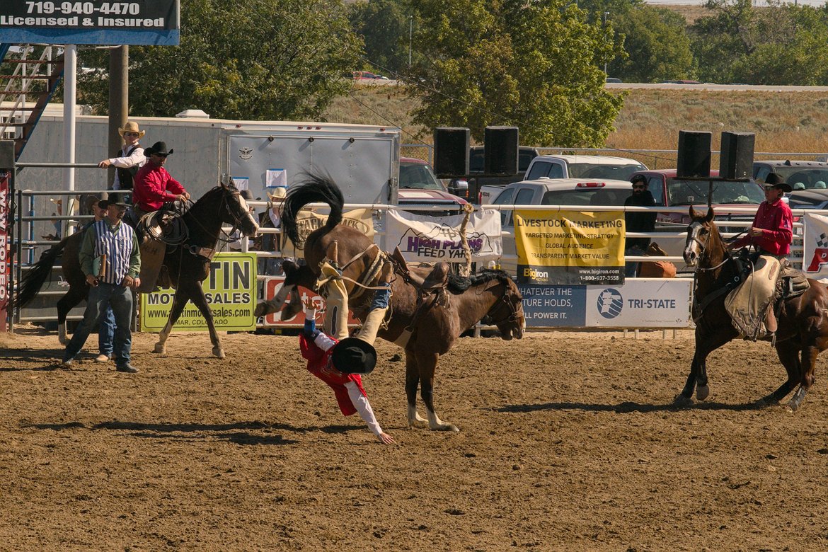 man falling off bronco, lamar rodeo photographed by luxagraf