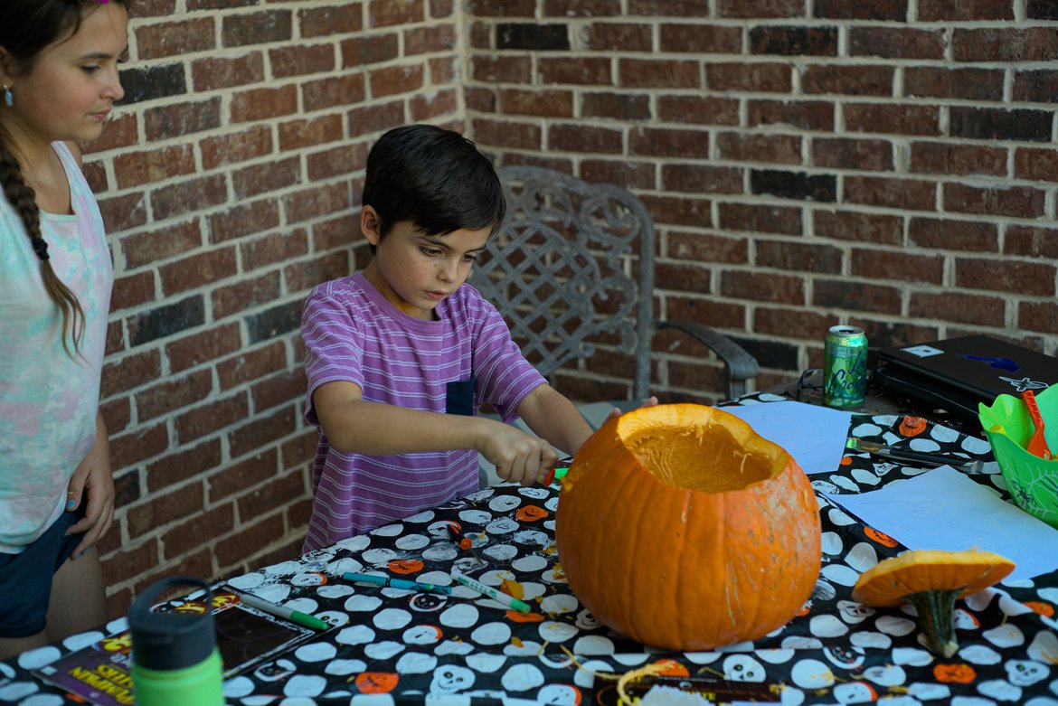carving pumpkins for halloween photographed by luxagraf