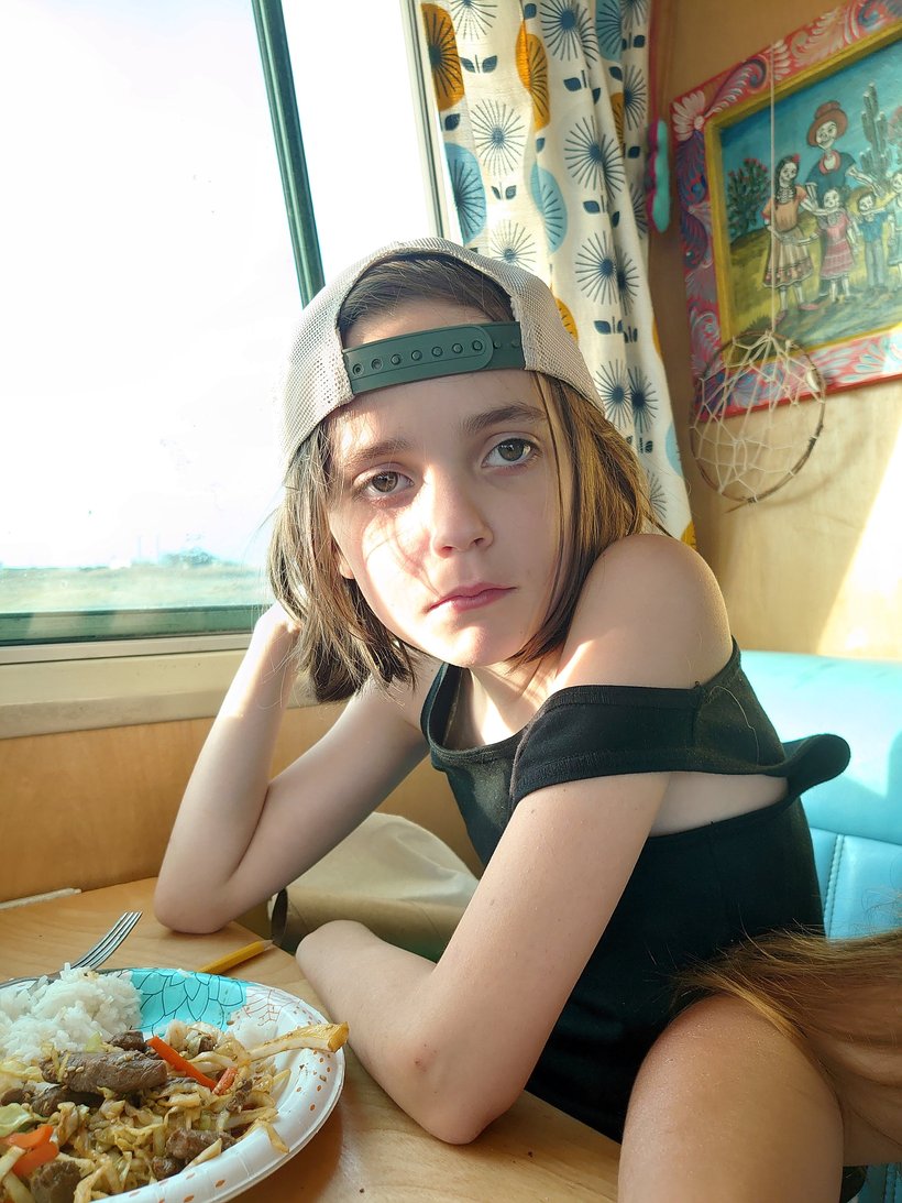 Lilah eating lunch in the bus, oregon inlet, north carolina photographed by luxagraf