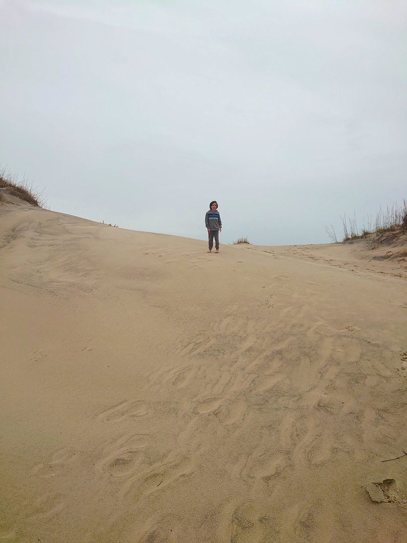 boy on the dunes, oregon inlet, north carolina photographed by luxagraf