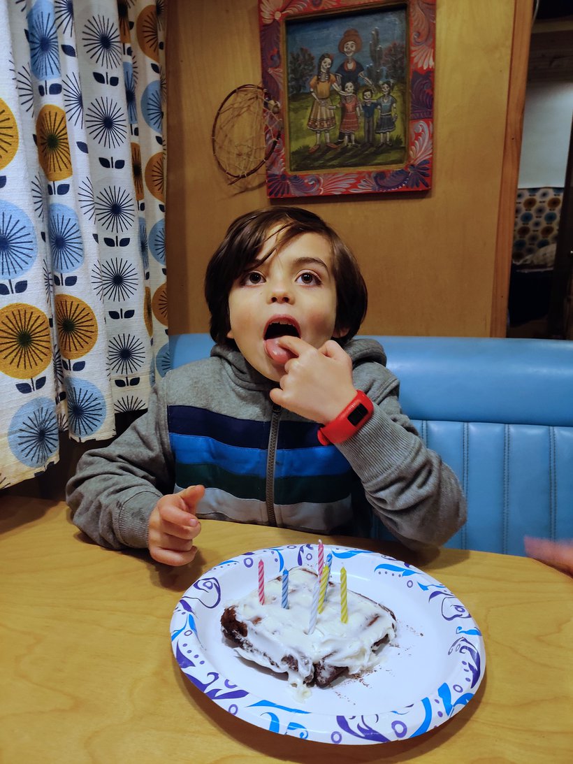 kid licking waffle cake photographed by luxagraf