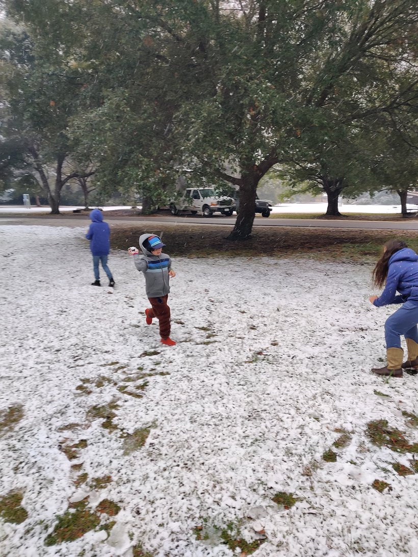 kids playing in the snow, huntington beach state park, sc photographed by luxagraf