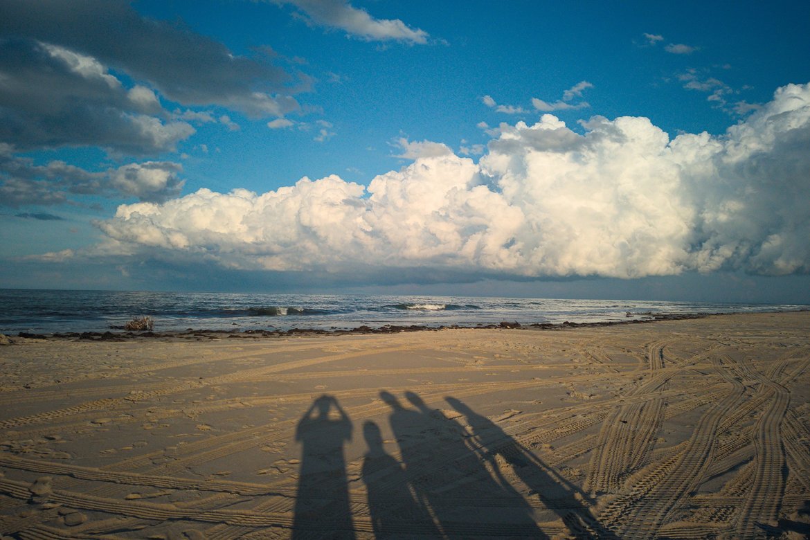 family shadow portrait by the sea, oregon inlet photographed by luxagraf