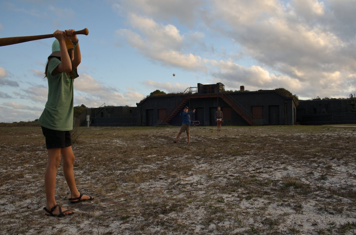 playing baseball in a sandy open lot photographed by luxagraf
