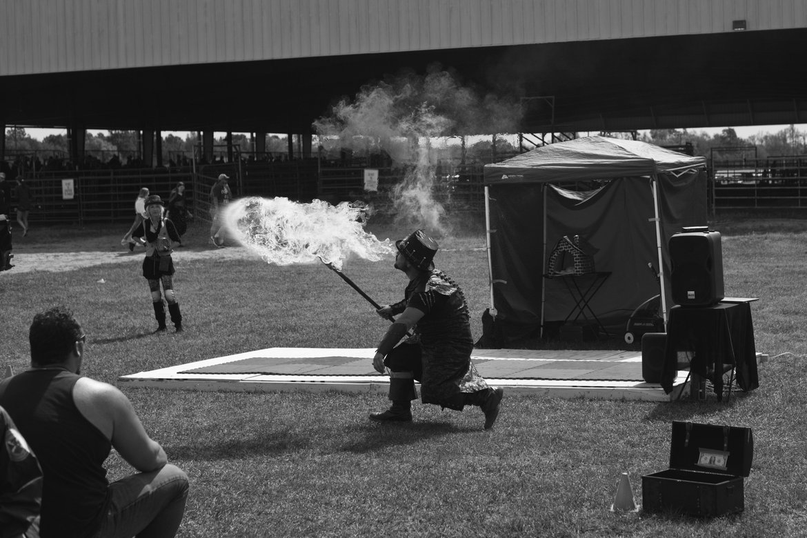Fire blower Renaissance Fair Pensacola, FL photographed by luxagraf