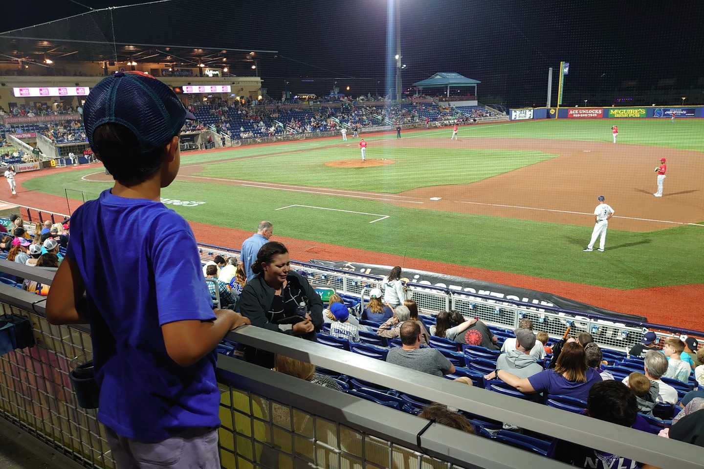 boy watching the blue wahoo's baseball game by Scott Gilbertson