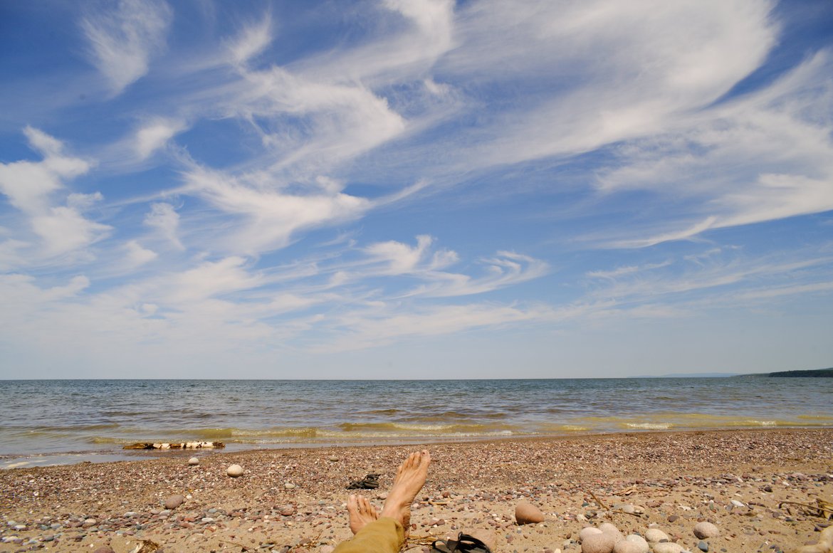 relaxing on the shore at little girl's point, MI photographed by luxagraf