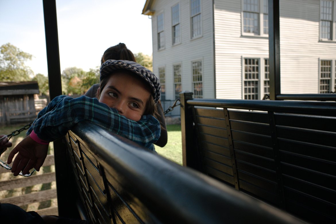 portrait of a boy on an open train car, greenfield village photographed by luxagraf
