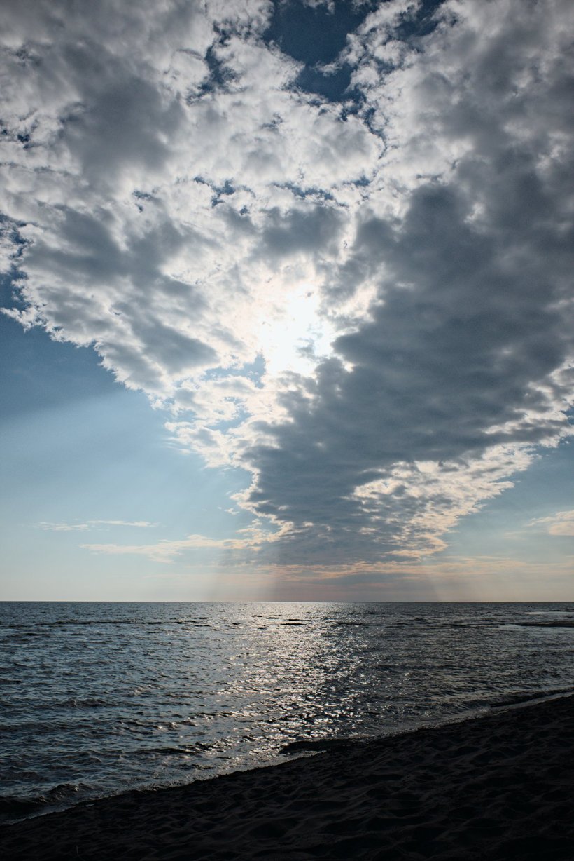 sun behind clouds, long point provincial park, canada photographed by luxagraf