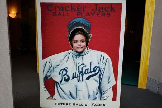 boy in a baseball card sign photographed by luxagraf