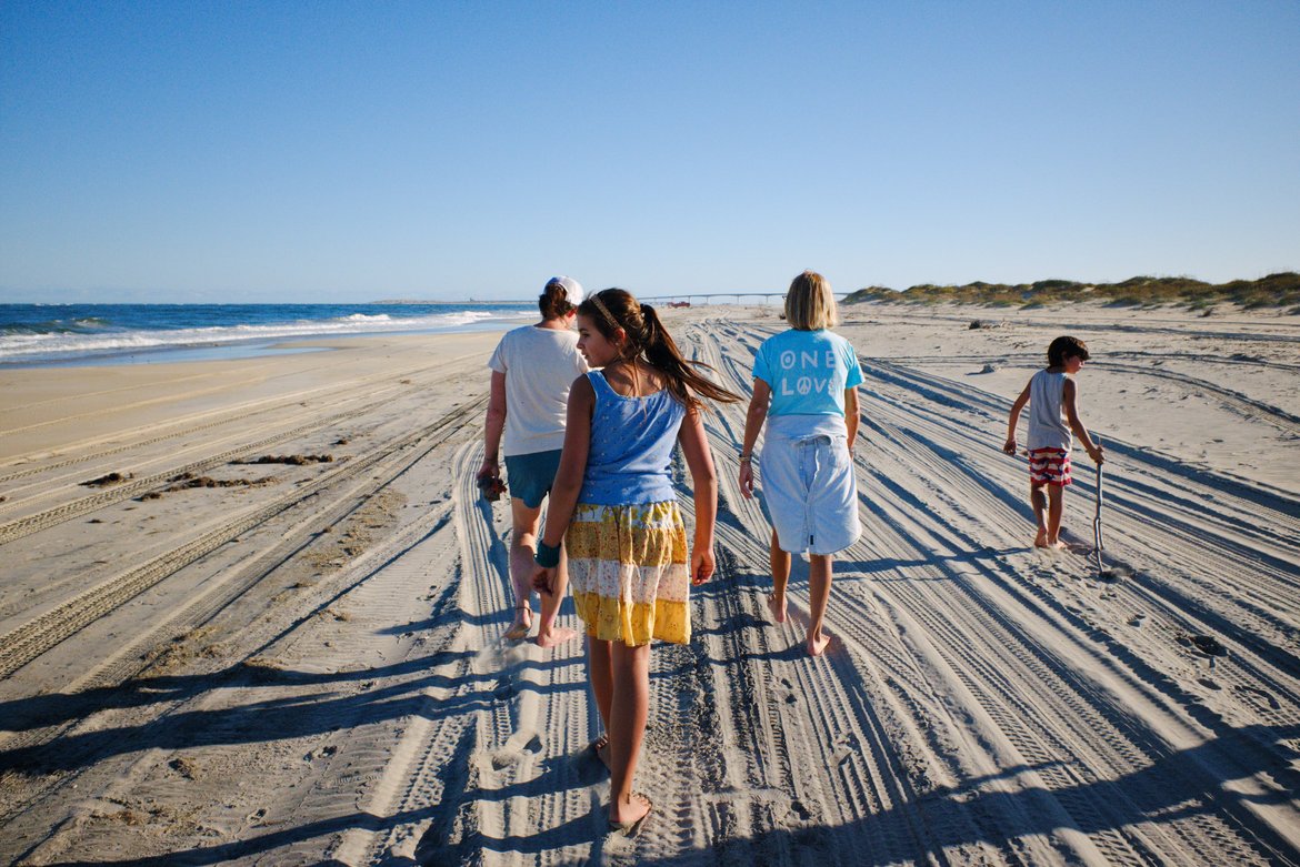 walking the beach at oregon inlet photographed by luxagraf