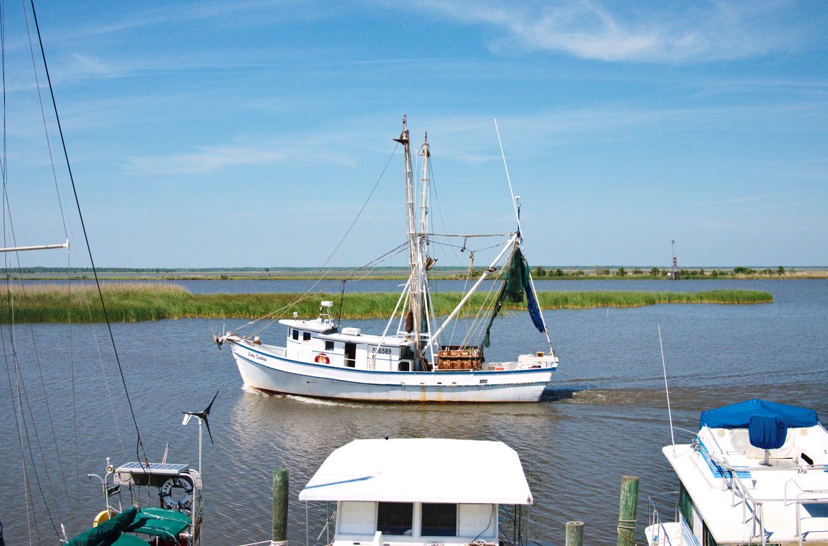 Shrimp boat headed back to the docks, Apalachicola, FL photographed by luxagraf