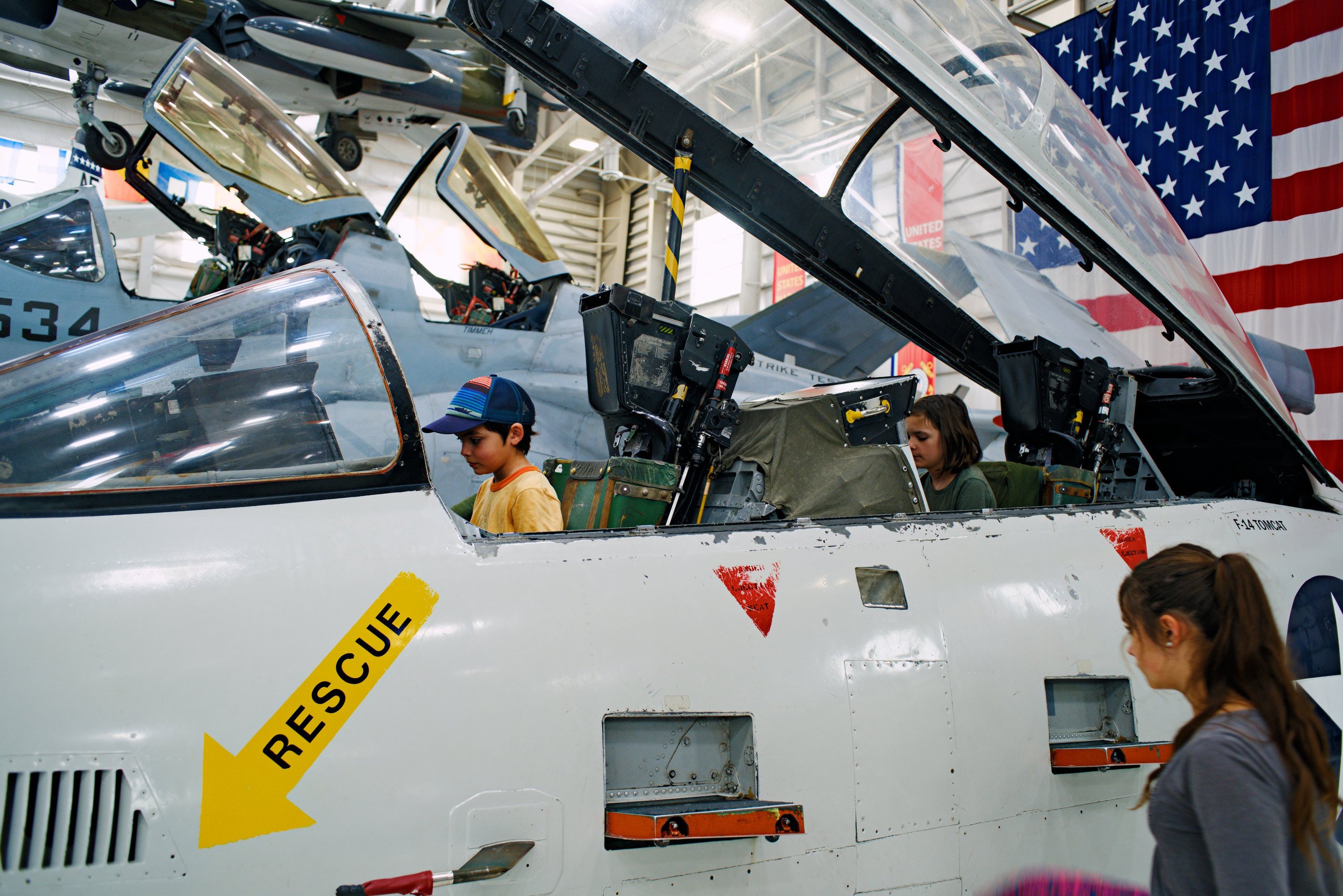 kids in an F-14 cockpit, Naval Air Museum photographed by luxagraf