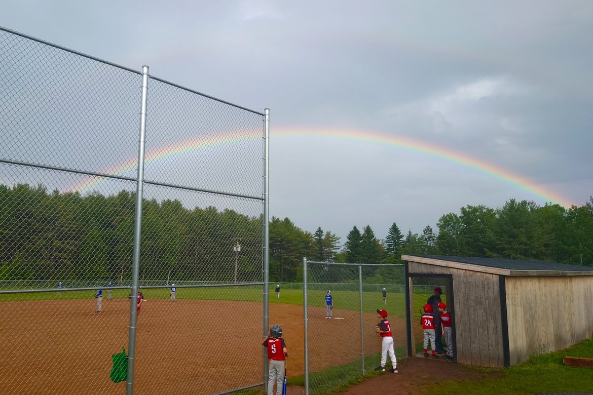 rainbow over baseball field, washburn, wi photographed by Scott Gilbertson