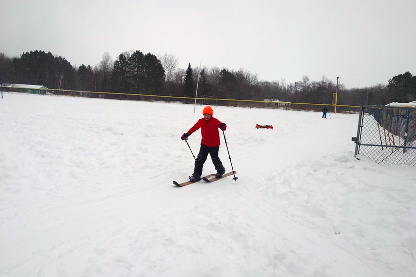 kids skiing down a hill in the snow by Scott Gilbertson