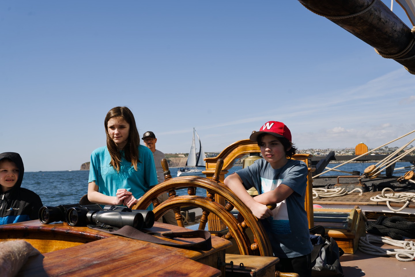 kids at the helm of the spirit of dana point photographed by Scott Gilbertson