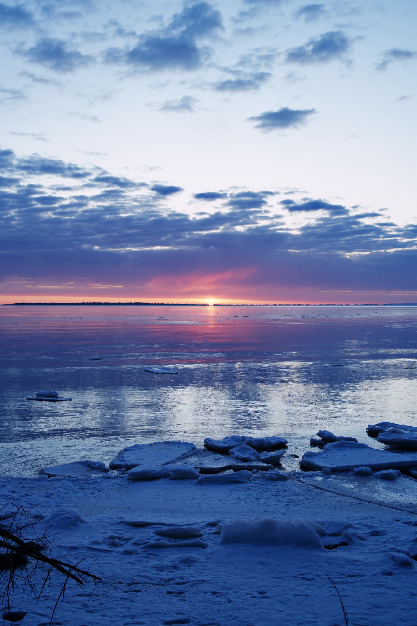 sun just peaking over the water, lake superior by Scott Gilbertson